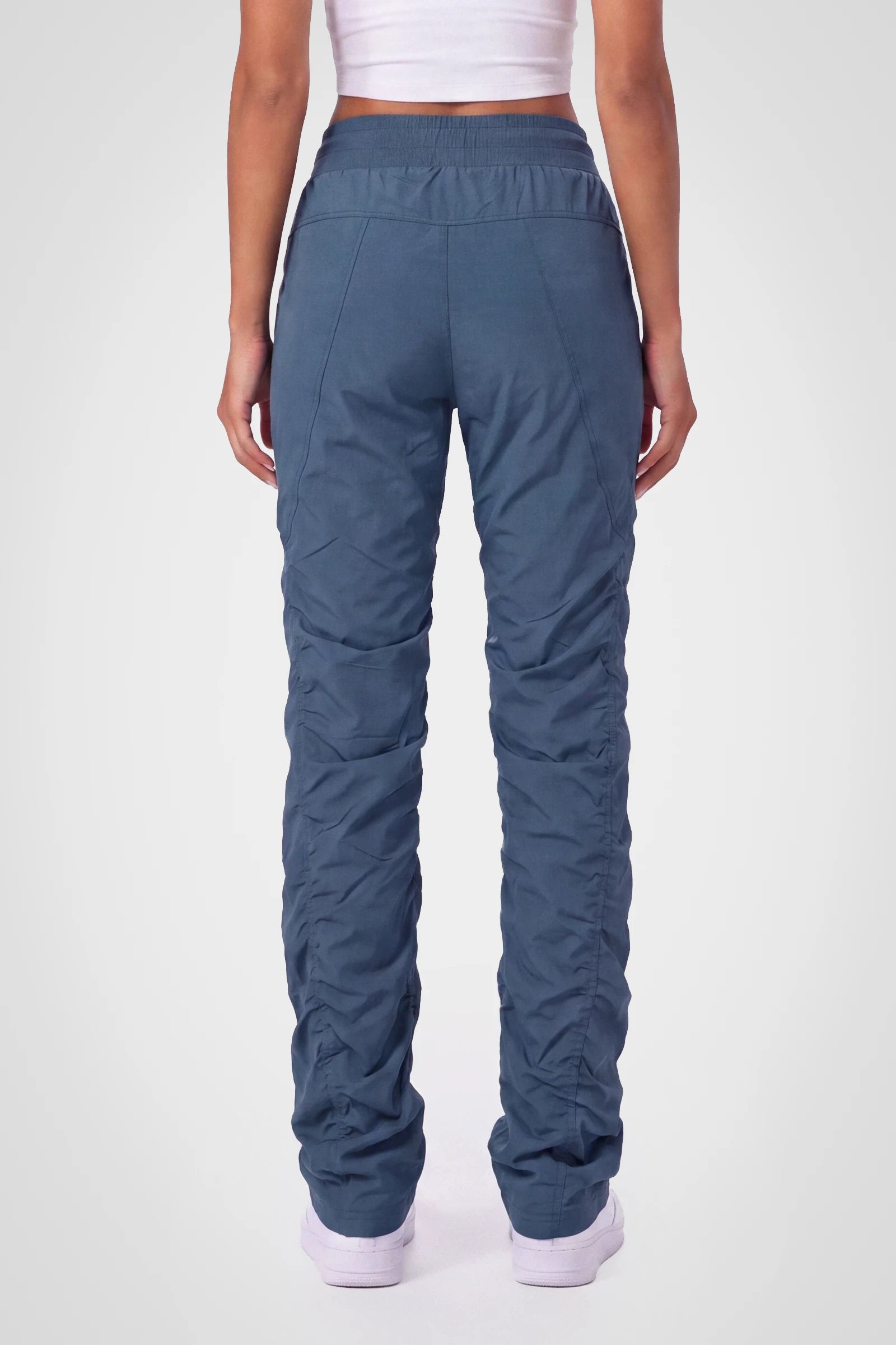 Women’s Key Largo Adventurous Pant, three-quarter studio view showing the tapered leg and gathered hem.