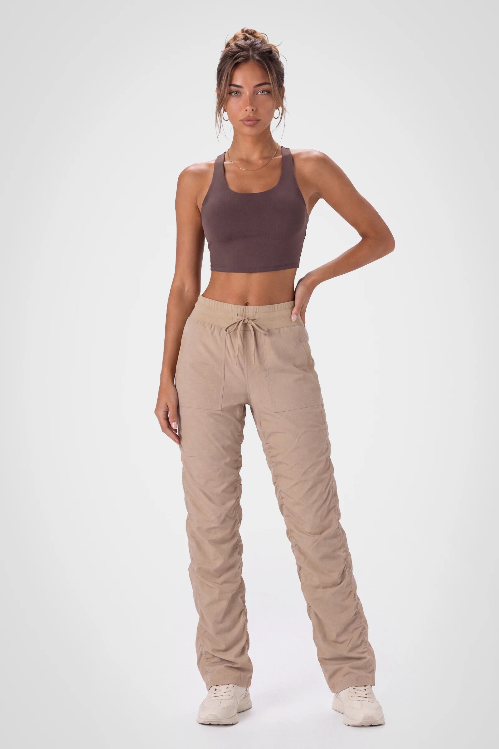 Women’s Doeskin Adventurous Pant, side studio view showing the relaxed tapered leg, patch pocket and gathered cuff.