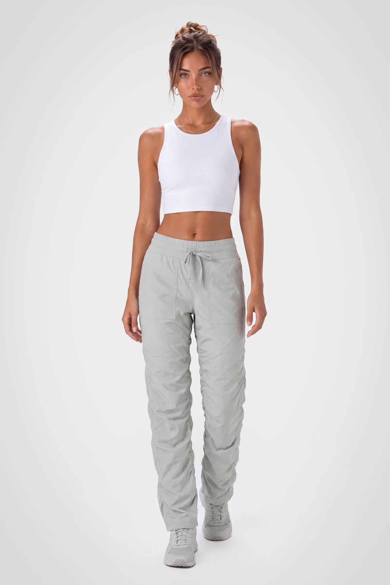 Women’s Harbor Mist Adventurous Pant, side studio view showing the relaxed tapered leg, patch pocket and gathered cuff.