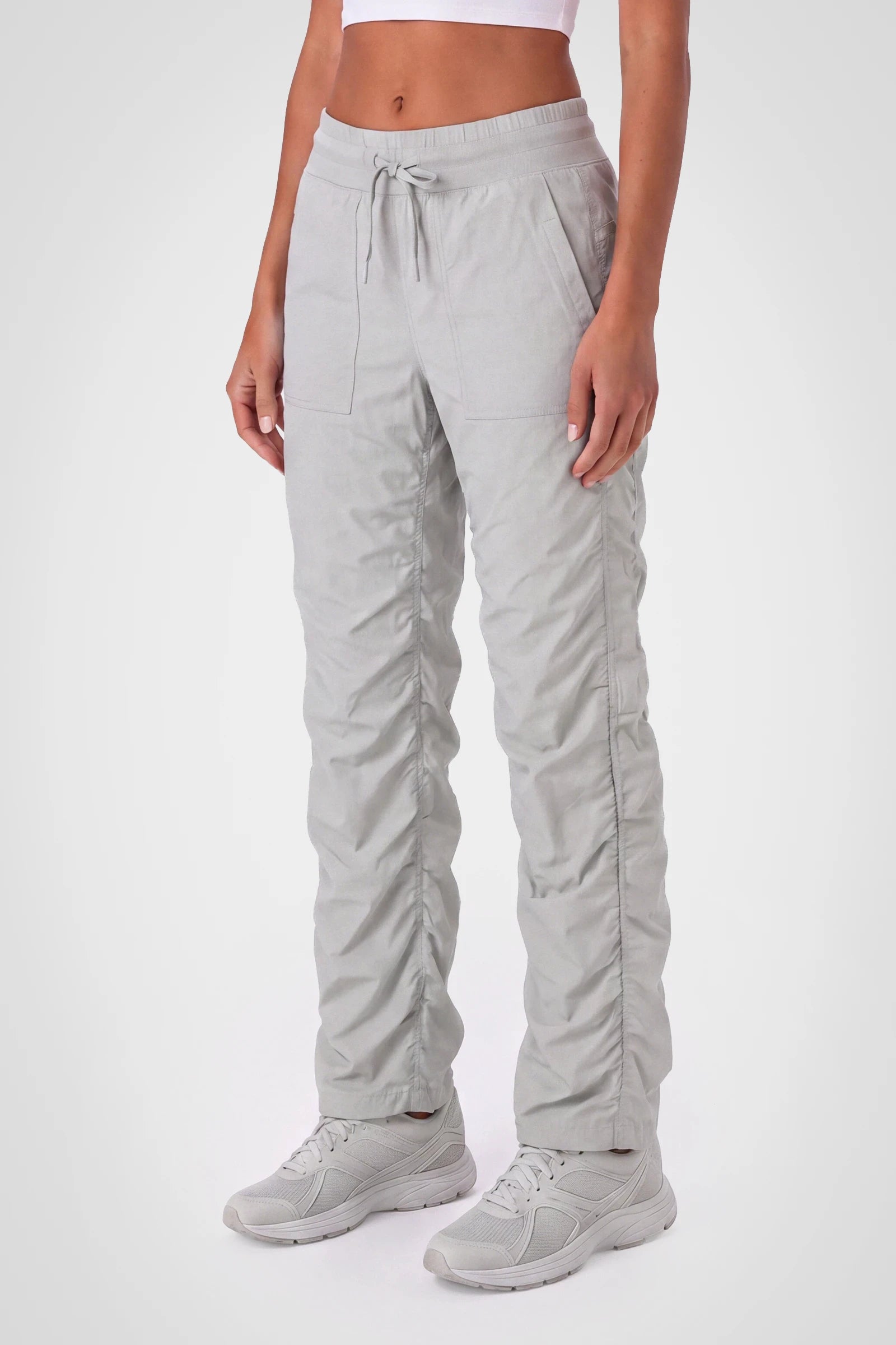 Women’s Harbor Mist Adventurous Pant, rear studio view showing the relaxed fit through the seat and ankle.