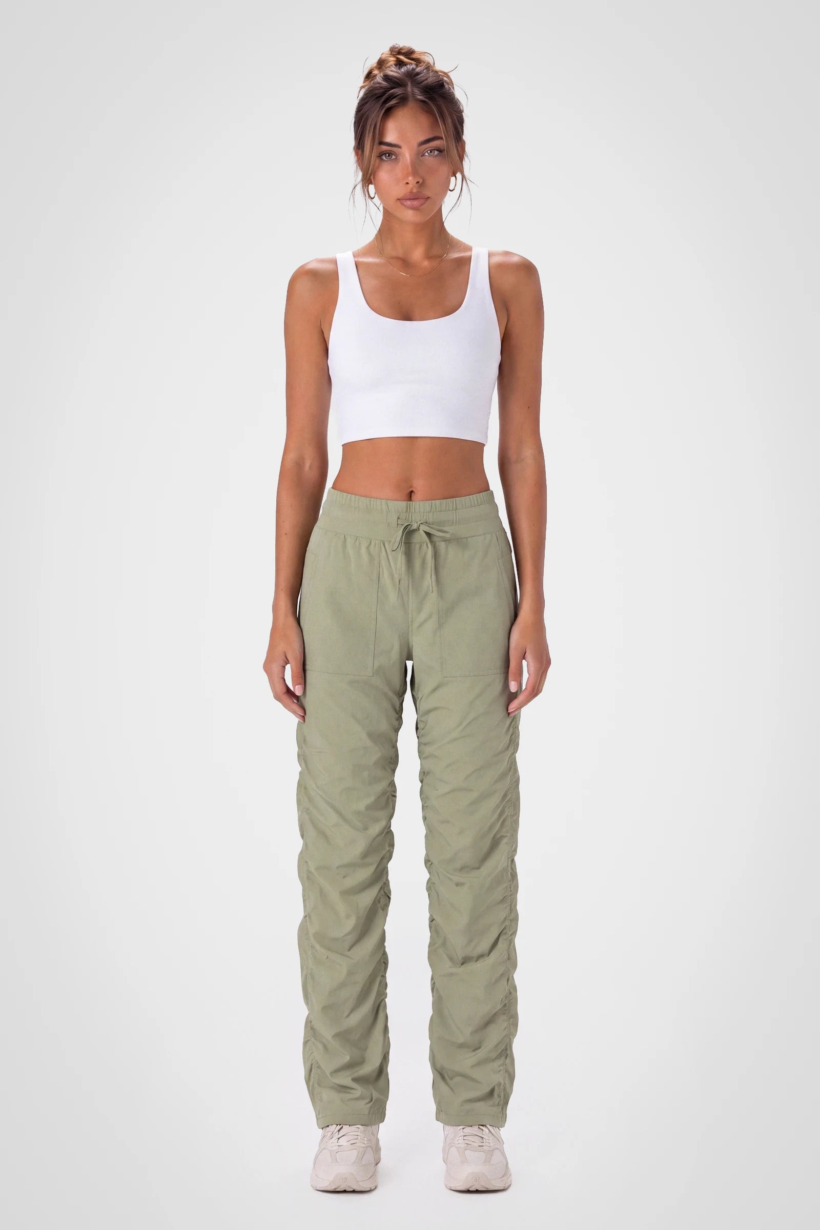 Women’s Silver Sage Adventurous Pant, side studio view showing the relaxed tapered leg, patch pocket and gathered cuff.